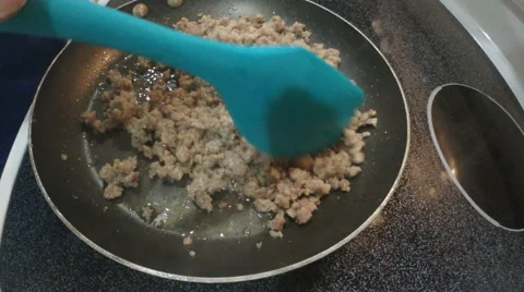 Browning sausage in a pan Stock Footage 65322386