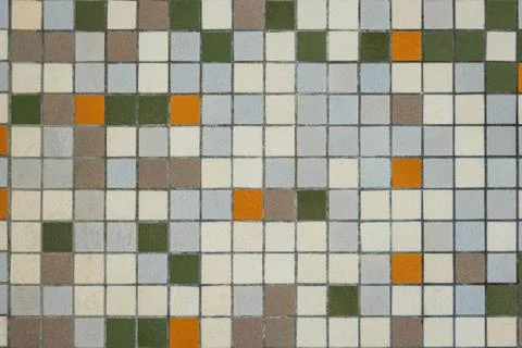 Brownish mozaic tiles in a bathroom pattern with brown, white , yellow and gr Stock Photos