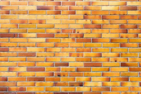 Brownish wall of clinker bricks Stock Photos