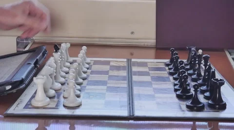 Browse chess games with the tablet in the compartment of the car 스톡 동영상 63301020