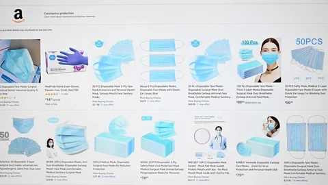 Browsing on amazon in search of disposable mask for coronavirus outbreak Stock Footage 126246695