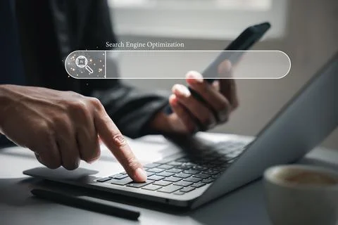 Browsing and searching the internet using a blank search bar Stock Photos