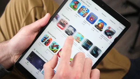 Browsing Android Play Store for Apps on a Tablet Stock-Footage 147000300