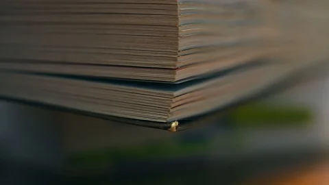  browsing an angle of a book with thumb of male hand Stock Footage 105128856