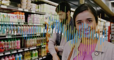 Browsing couple selecting drinks in market aisle, with yogurt cups, equalizer Stock Photos