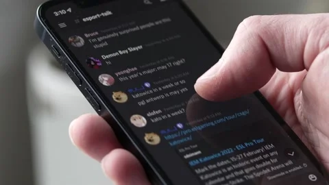Browsing a Discord Server With People Chatting on a Smartphone App Video stock 169893982