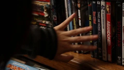 Browsing DVDs Stock Footage 79085146