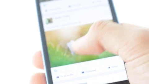 Browsing on facebook account, texting, like Stock Footage 74290972