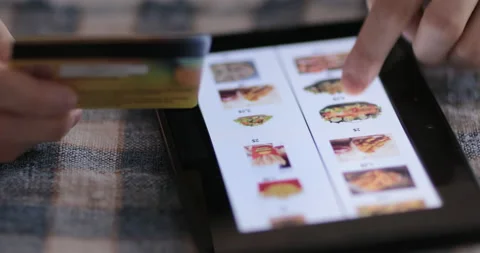 Browsing fast food menu on tablet and making online order. Stock Footage 148632435