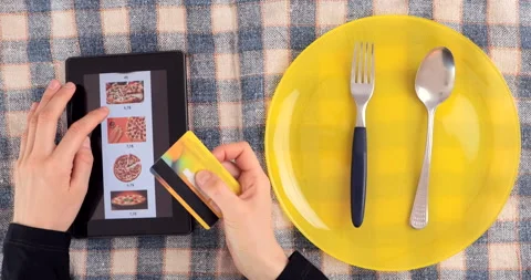 Browsing fast food menu on tablet and making online order. Stock Footage 148683568