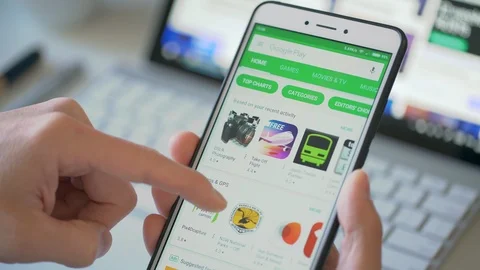 Browsing the Google Play Store on a smartphone Stock Footage 85906016
