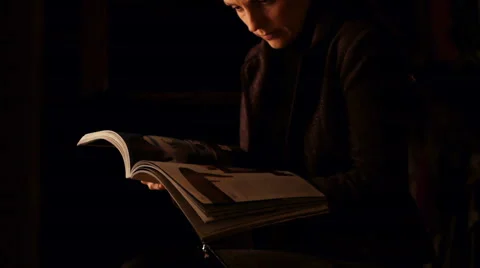 Browsing of the illustrated magazine Stock Footage 60071055