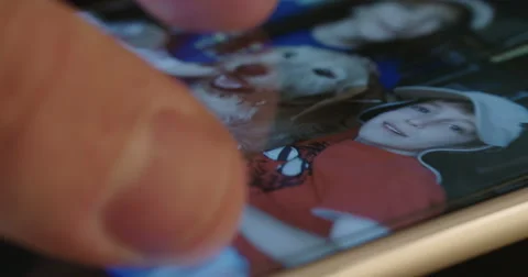 Browsing in image gallery on a mobile phone Stock-Footage 67487219