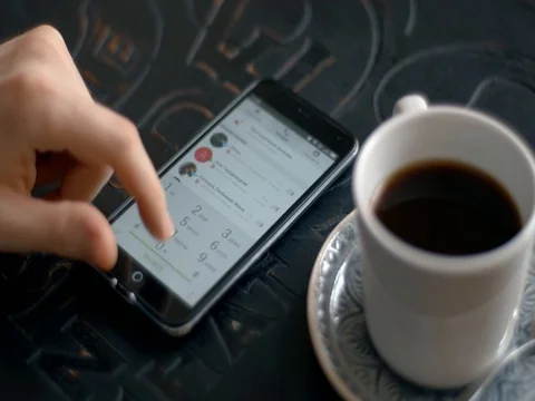 Browsing information on smart at cafe 스톡 동영상 71299406