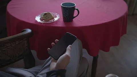 Browsing instagram with a cup of coffee and cake wide Stock Footage 83773459