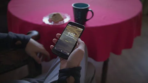 Browsing instagram with a cup of coffee and cake Stock Footage 83773543