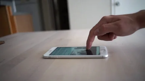 Browsing the internet. Scrolling through Social media with smartphone Stock Footage 74252387