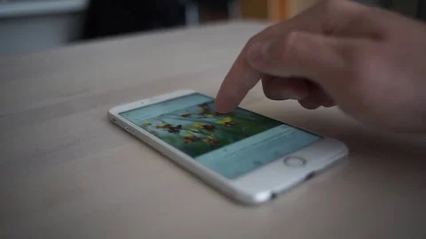 Browsing the internet. Scrolling through social media with smartphone Stock Footage 74252423