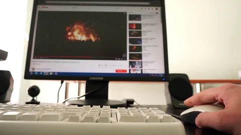 Browsing on internet social media viewing video on desktop computer Stock Footage 105664172
