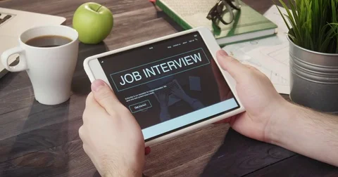 Browsing job interview info using digital tablet at desk Stock Footage 80736839