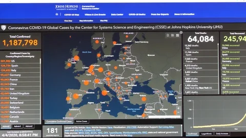 Browsing John Hopkins University Interactive Map Showing Coronavirus COVID-19 Stock Footage 127763754