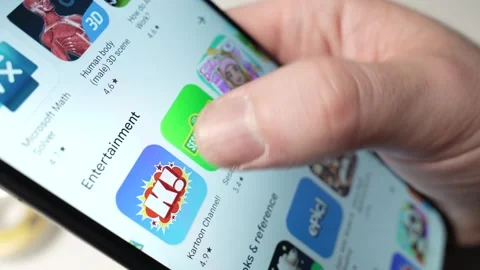 Browsing Kids Entertainment Apps on a Smartphone Screen Closeup Stock Footage 270815109