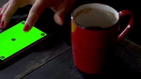 Browsing mobile phone while having coffee, close up slider view Stock Footage 105024838