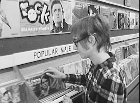 BROWSING MUSIC AT A RECORD STORE (1969) Stock Footage 168598109