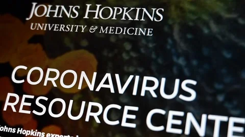 Browsing in official coronavirus resource center johns hopkins university site Video stock 126557281