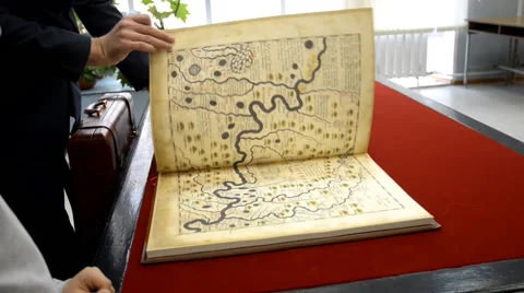 Browsing the old book Stock-Footage 42612173