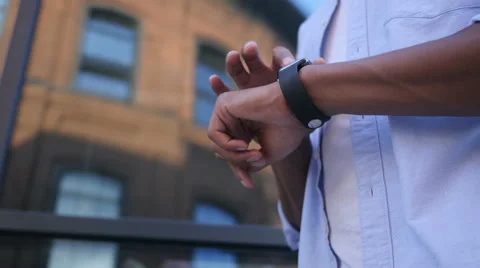 Browsing Online on Smartwatch, Standing Young Black Male Designer Stock Footage 66613877