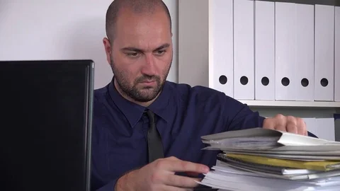 Browsing searching paperwork documents stack busy business worker in the office Stock Footage 80564556