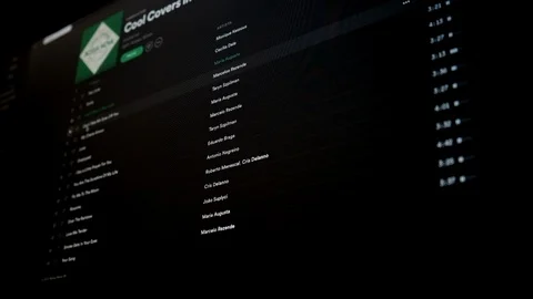 Browsing Spotify on Mac Computer Stock Footage 123147471