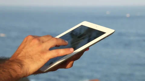 Browsing tablet Next to the Seashore Panoramic Video stock 40906091