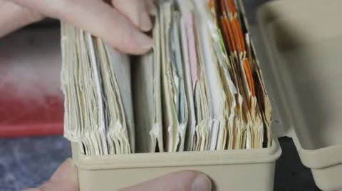 Browsing through recipe files Stock Footage 18011495