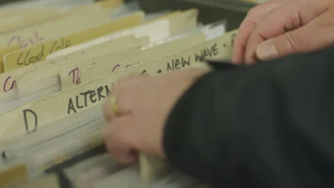 Browsing Through Vinyl Record Collection. Stock-Footage 136617632