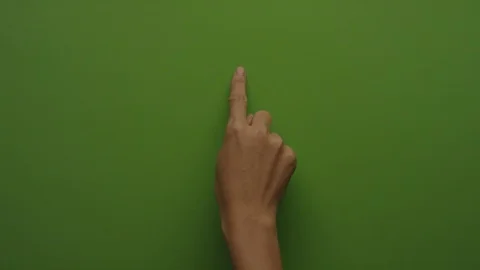 Browsing touch screen display with index finger on green screen Vidéo 94729015
