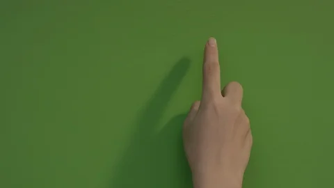 Browsing touch screen display with index finger on green screen. Vidéo 94735632