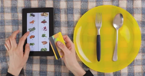 Browsing vegetables menu on tablet and making online order. Stock Footage 148625142