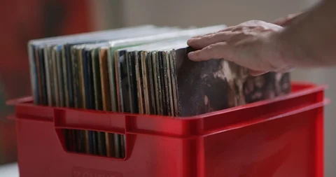 Browsing vinyl records in a red crate Stock Footage 112598593