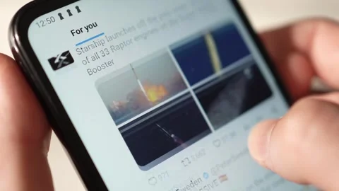 Browsing X Social Media app Feed on a Smartphone Screen Stock Footage 256691469