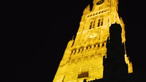 Bruges Belfry in in golden yellow light Stock Footage