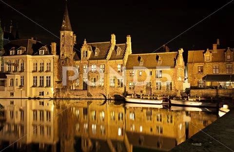 Bruges canal at night, belgium Stock Photos