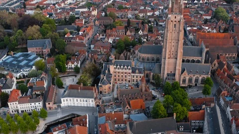 Bruges: flight over red roofs of houses Stock Footage 124305092