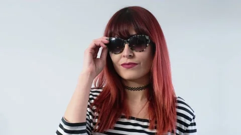 The Bruised Redhead Looks Directly At The Camera. Violence Against Women 스톡 동영상 142683563