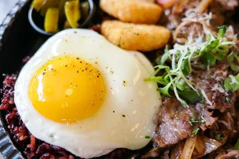 Brunch plating with sunny side up fried egg Stock Photos