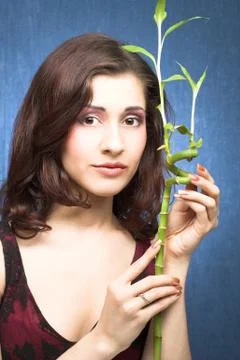 Brunette with bamboo Stock Photos
