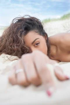 Brunette on beach Stock Photos