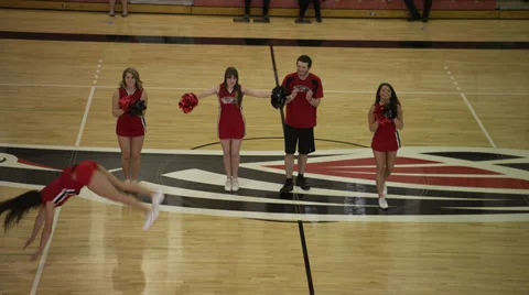 Brunette Cheerleader Does Impressive Flips Stock Footage 35244289