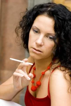 Brunette with cigarette Stock Photos